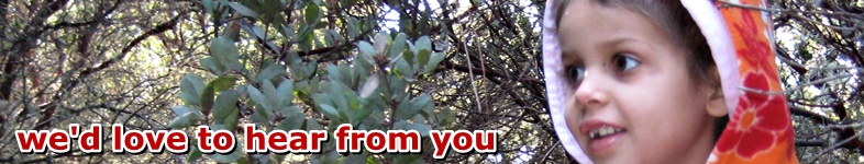 Sofia smiling in amongst trees: We'd love to hear from you